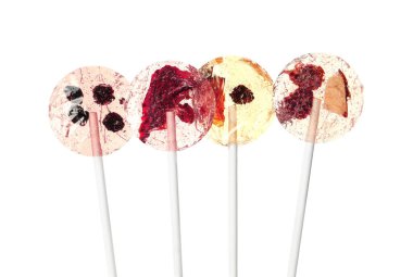 Sweet colorful lollipops with berries on white background clipart