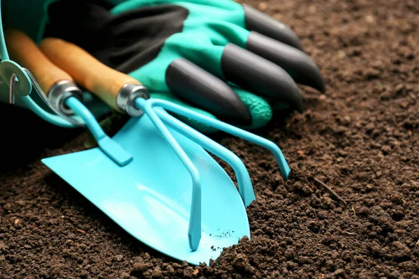 Overturned Bucket Gardening Tools Gloves Fresh Soil Closeup — Stockfoto