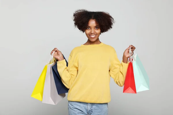 Happy African American Woman Shopping Bags Light Grey Background — Foto Stock