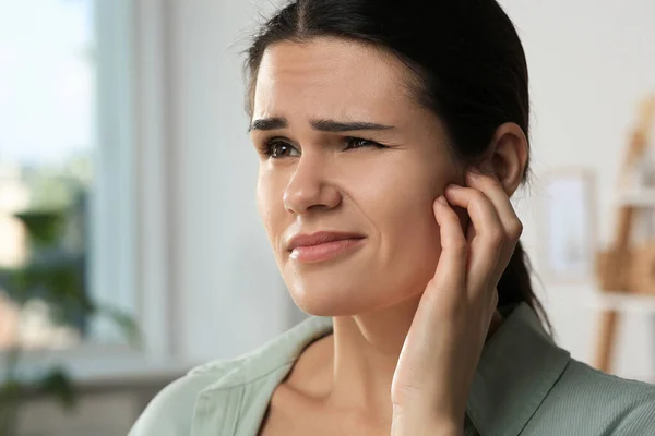 Young Woman Suffering Ear Pain Room Closeup — Stock Photo, Image