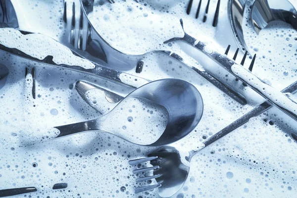 Different Silverware Foam Flat Lay Toned Blue — Stock Photo, Image