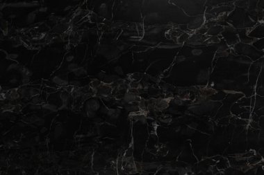 Arkaplan olarak siyah mermer yüzey, yakın görünüm