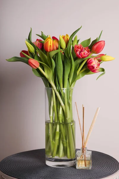 Beautiful Bouquet Colorful Tulips Glass Vase Table Pink Background — Foto de Stock