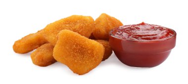 Beyaz üzerine ketçap serpiştirilmiş lezzetli tavuk nuggetları.