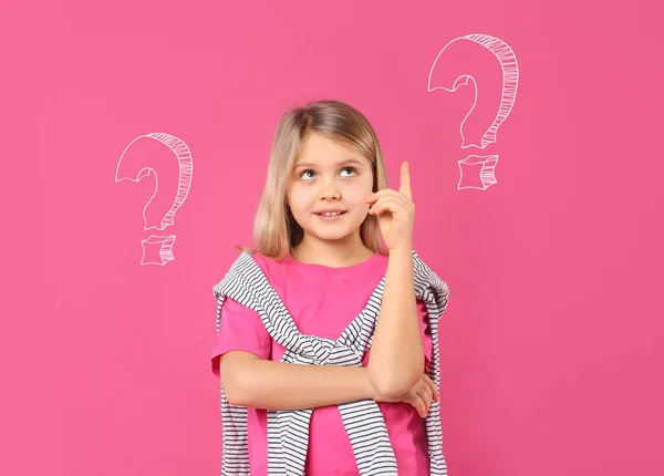 Choice in profession or other areas of life, concept. Making decision, cute little girl surrounded by drawn question marks on pink background