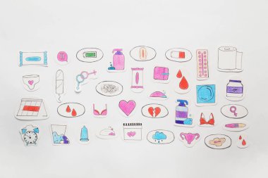 Woman`s health. Different paper figures on white background, flat lay