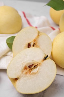 Delicious apple pears on white marble table, closeup