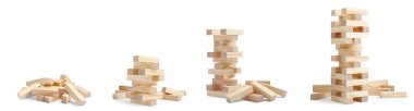 Playing Jenga. Wooden blocks and constructions on white background