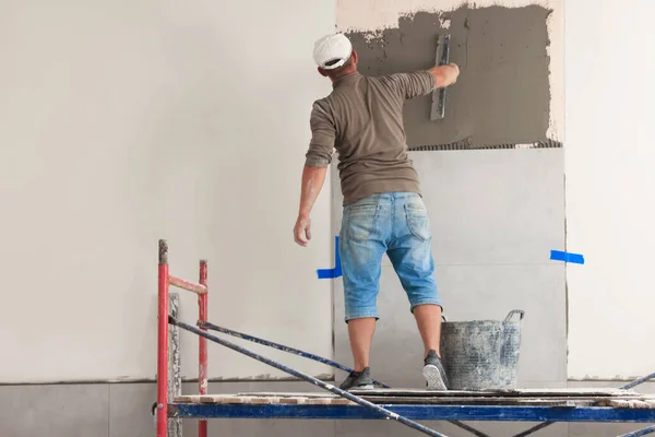 Worker Spreading Adhesive Mix Wall Tile Installation Indoors Back View — Stockfoto