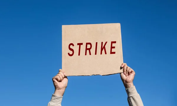 Young Woman Holding Strike Sign Blue Sky Closeup — Stockfoto