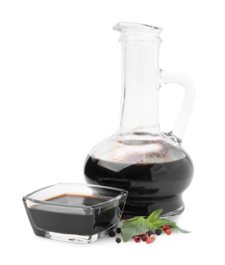 Organic balsamic vinegar, basil and pepper isolated on white