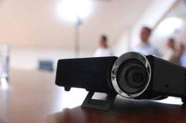 Modern video projector on table during conference