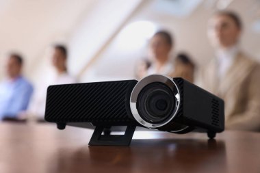 Modern video projector on table during conference