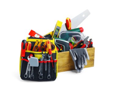 Wooden box with different tools isolated on white