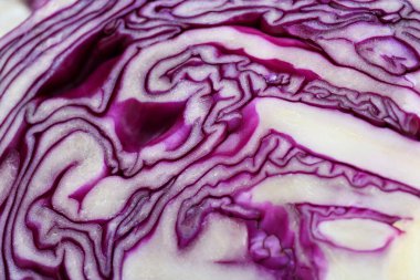 Half of fresh red cabbage as background, closeup