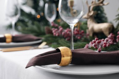 Beautiful festive table setting with Christmas decor, closeup. Space for text