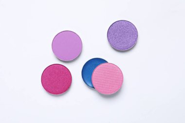 Different beautiful eye shadows on white background, flat lay