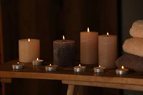 Spa Composition Burning Candles Towels Wooden Table Wellness Center — Stockfoto