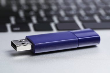 Usb flash drive on laptop, closeup view