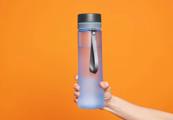 Woman Holding Bottle Water Orange Background Closeup — Photo