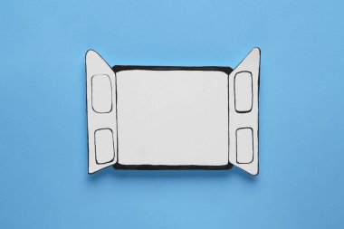 Open paper window frame on light blue background. Space for text