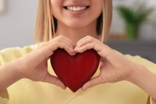 Young Woman Holding Red Heart Indoors Closeup Volunteer Concept — Stockfoto