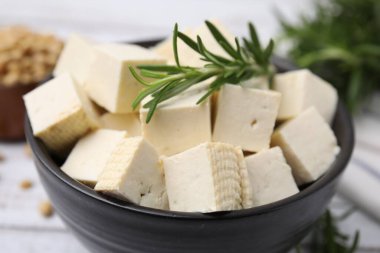 Delicious tofu cheese in bowl, closeup view