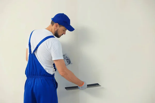 Professional Worker Plastering Wall Putty Knives Indoors Space Text — Stockfoto