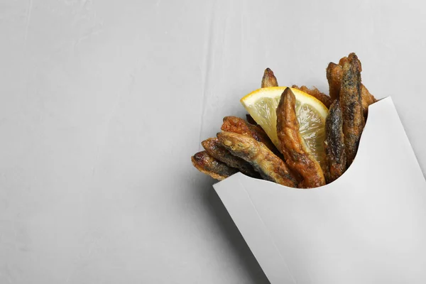 Paper Bag Delicious Fried Anchovies Lemon Slice Light Table Top — Photo