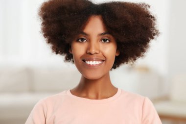 Portrait of smiling African American woman at home