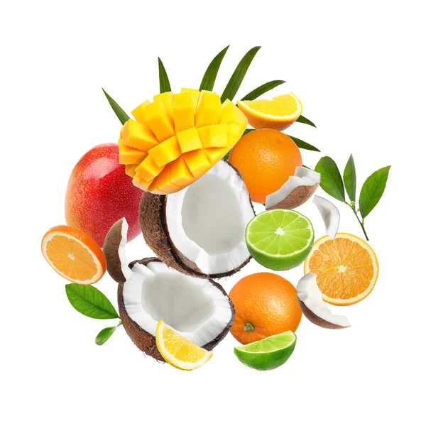 Different fresh fruits and leaves flying on white background