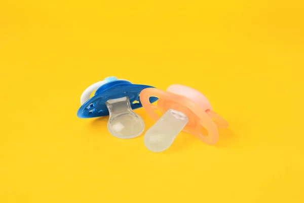 Colorful Baby Pacifiers Bright Orange Background — Stock fotografie