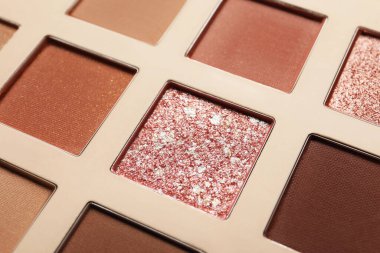 Beautiful eye shadow palette as background, closeup