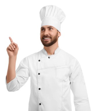 Smiling mature male chef pointing at something on white background