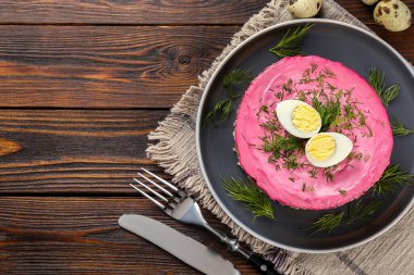 Herring under fur coat salad served on wooden table, flat lay with space for text. Traditional Russian dish