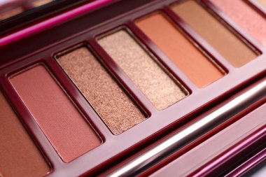Beautiful eye shadow palette on table, closeup