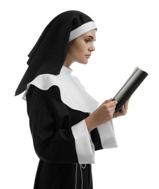 Young nun reading Bible on white background
