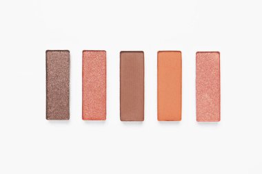 Different beautiful eye shadows on white background, flat lay