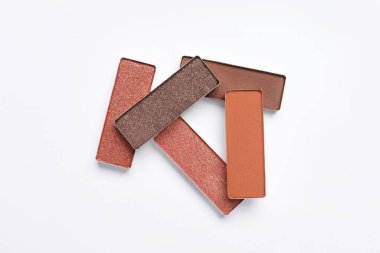 Beautiful eye shadow refill pans on white background, flat lay