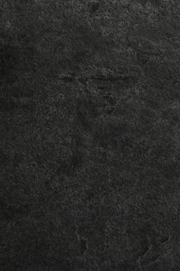 Arkaplan olarak koyu gri taş yüzeyin dokusu, yakın plan