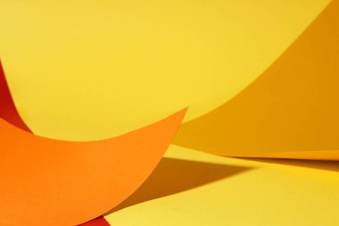 Different colorful paper sheets on yellow background