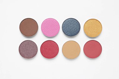 Different beautiful eye shadows on white background, flat lay