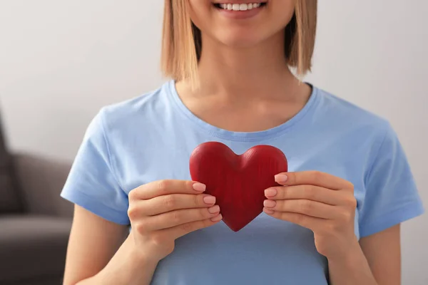 Young Woman Holding Red Heart Indoors Closeup Volunteer Concept — Stockfoto