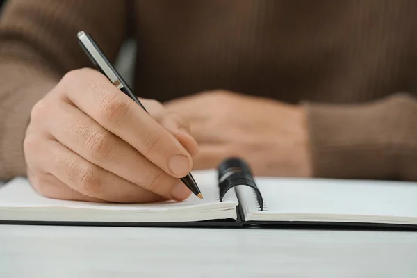 Man Writing Notebook White Table Closeup Space Text — Foto Stock