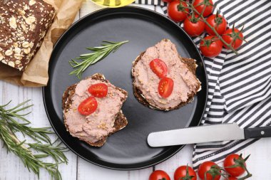 Delicious liverwurst sandwiches served on white wooden table, flat lay