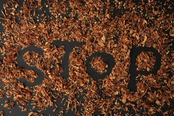 Word Stop Made Dry Tobacco Dark Grey Background Flat Lay — Foto Stock