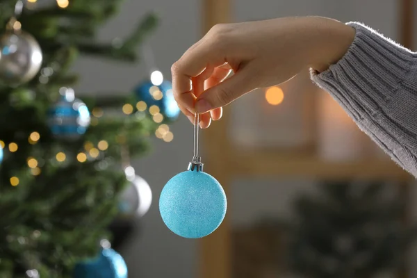 Woman Holding Festive Ball Christmas Tree Indoors Closeup — Fotografia de Stock