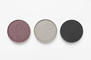 Different beautiful eye shadows on white background, flat lay