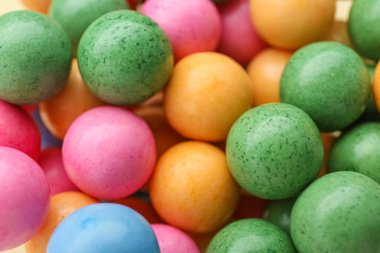 Many bright chewy gumballs as background, closeup
