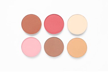 Different beautiful eye shadows on white background, flat lay